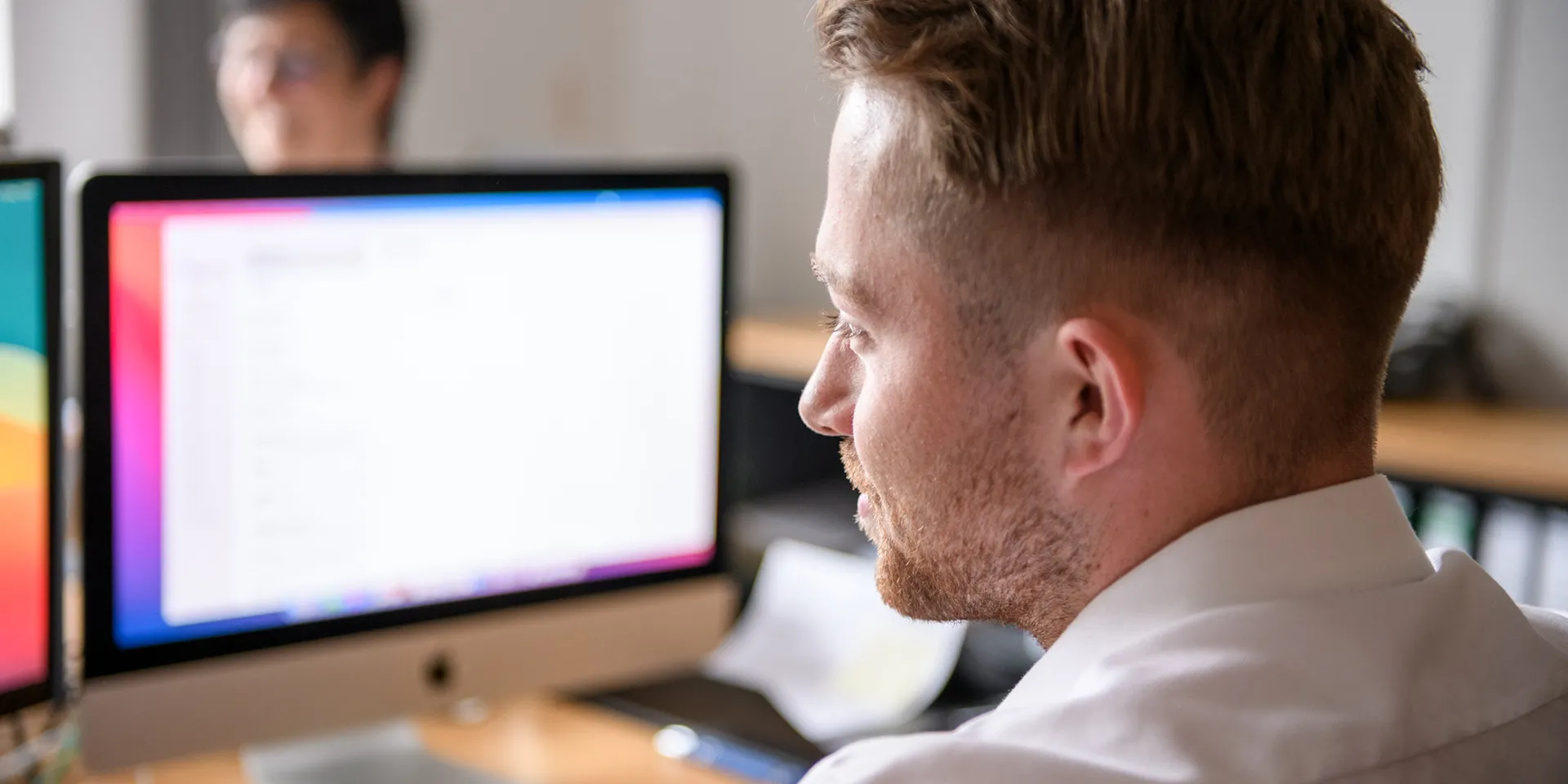 thenex employee at his workstation in the Bocholt office